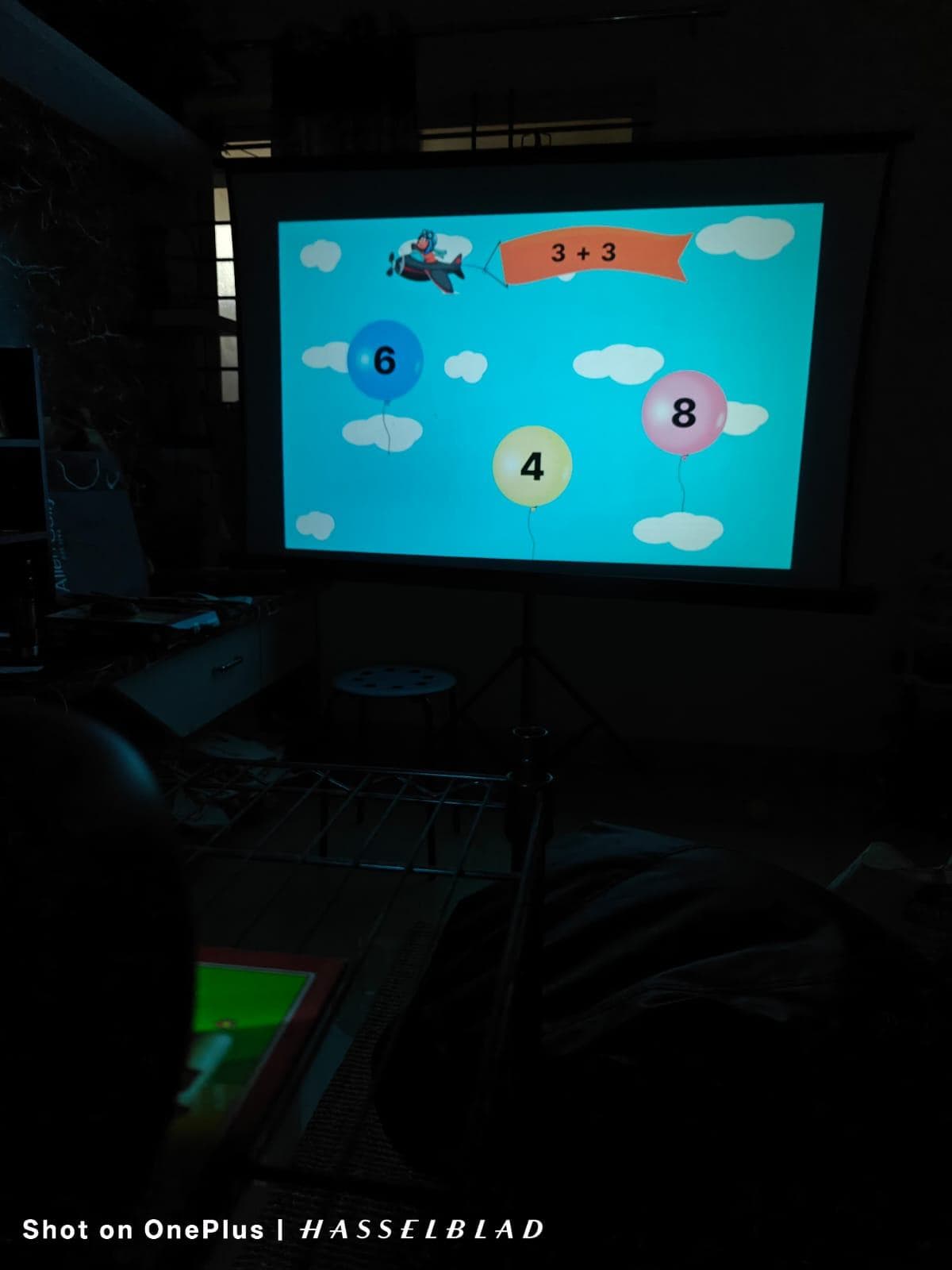 Child playing Balloon Shooter